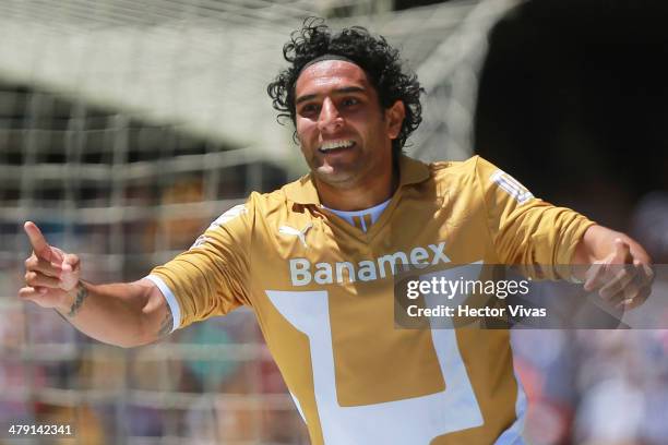 Martin Bravo of Pumas celebrates during a match between Pumas UNAM and Atlante as part of the 11th round Clausura 2014 Liga MX at University Olympic...