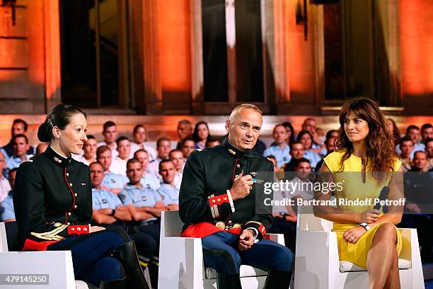 Members of the Republican Horse Guards Helene Bussy, Colonel Alain Puligny and Actress Laetitia Milot attend the 'Une Nuit avec la Police et la...