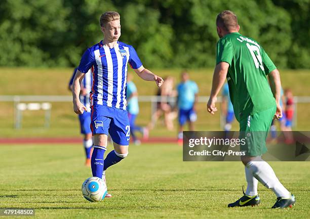 Mitchell Weiser of Hertha BSC passes the ball during the game between dem 1. FC Luebars and Hertha BSC on July 1, 2015 in Berlin, Germany.