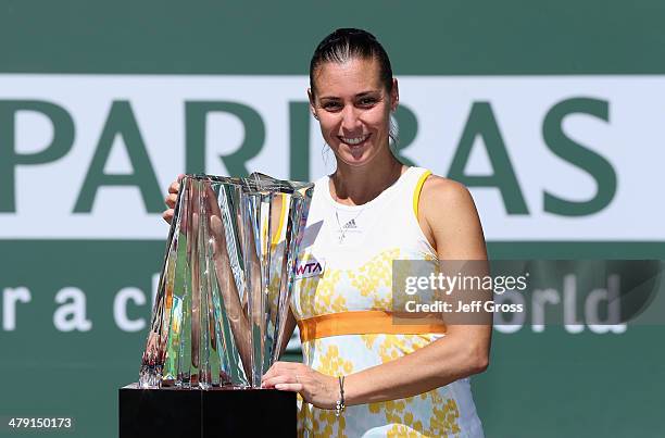 Flavia Penneta of Italy poses with the trophy following her WTA women's final victory over Agnieszka Radwanska of Poland during the BNP Paribas Open...