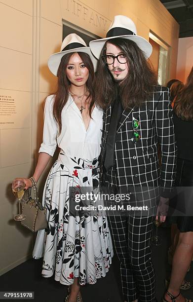 Betty Bachz and Joshua Kane attend the Tiffany & Co. Immersive exhibition 'Fifth & 57th' at The Old Selfridges Hotel on July 1, 2015 in London,...