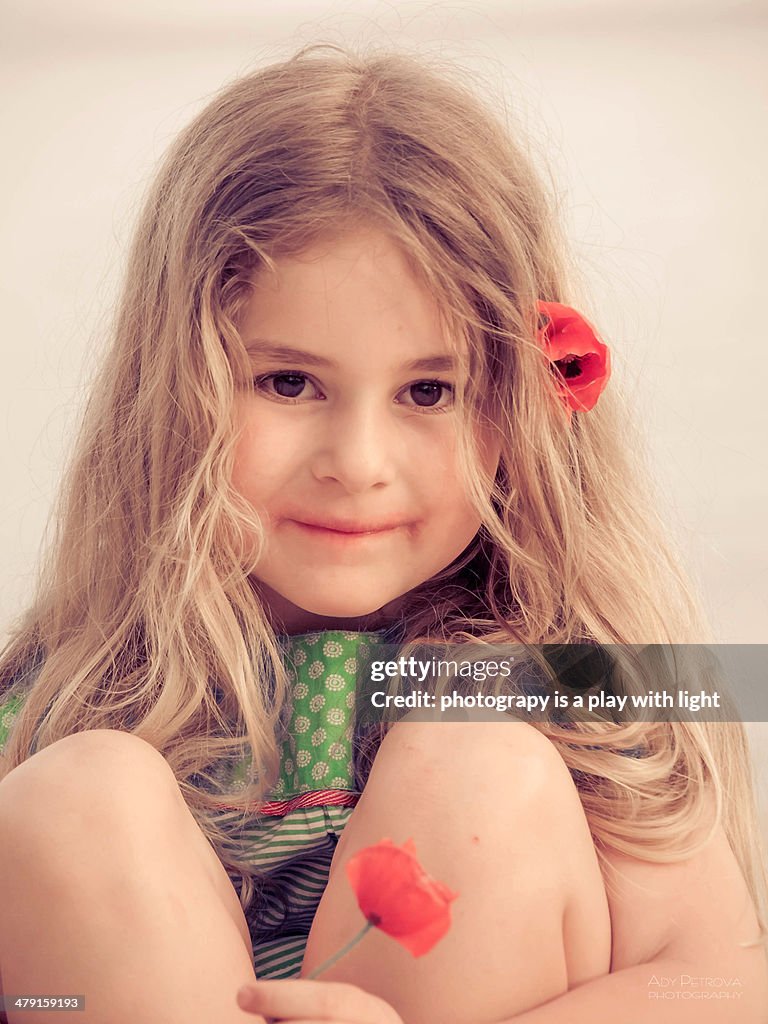 Girl with flowers poppy