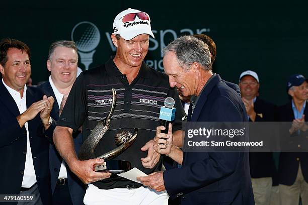 John Senden of Australia accepts his trophy after the final round of the Valspar Championship at Innisbrook Resort and Golf Club on March 16, 2014 in...