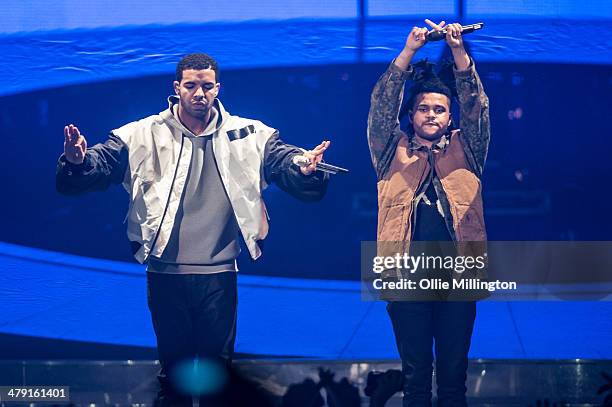 Drake and The Weeknd performs on stage during a date of his "Nothing Was the Same" 2014 World Tour at Nottingham Capital FM Arena on March 16, 2014...