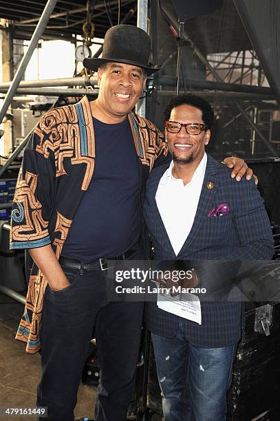 Musician Stanley Clarke and Host D.L. Hughley attend Day 2 of Jazz In The Gardens at Sun Life Stadium on March 16, 2014 in Miami Gardens, Florida.