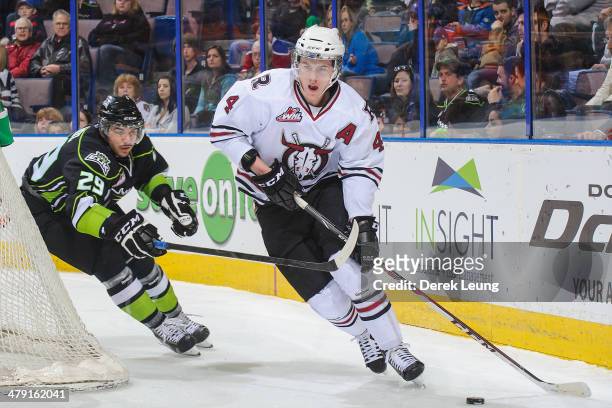 Mitchell Moroz of the Edmonton Oil Kings chases Haydn Fleury of the Red Deer Rebels during a WHL game at Rexall Place on March 16, 2014 in Edmonton,...