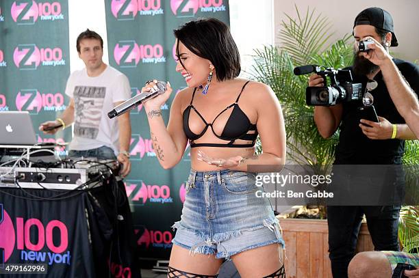 Singer-songwriter Demi Lovato performs during Demi Lovato's Debut of her New Single, "Cool for the Summer," with Z100 at Gansevoort Park Avenue on...