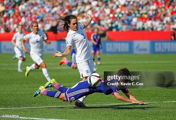 Claire Rafferty of England fouls Saori Ariyoshi of Japan to concede a penalty during the FIFA Women's World Cup Semi Final match between Japan and...