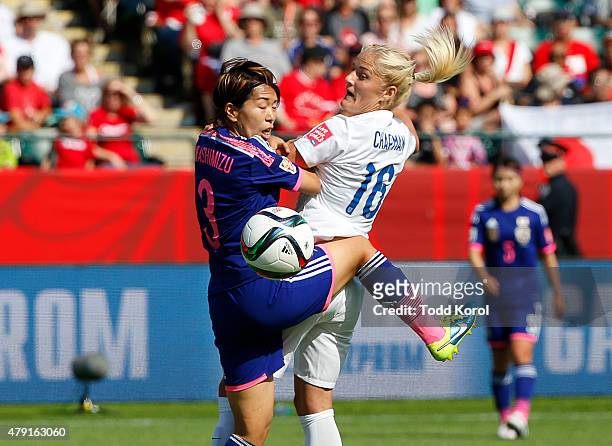 Katie Chapman of England and Azusa Iwashimizu of Japan go up for a header during the FIFA Women's World Cup Canada Semi Final match between England...