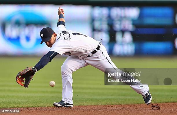 Jose Iglesias of the Detroit Tigers reaches for the ground ball off the bat of Starling Marte of the Pittsburgh Pirates in the first inning of the...