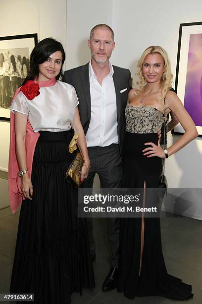 Eva Lanska, Jean-David Malat and guest attend a private view of "Raw Footage" at The Opera Gallery on July 1, 2015 in London, England.