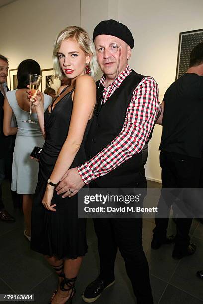 Nikita Andrianova and Sascha Lilic attend a private view of "Raw Footage" at The Opera Gallery on July 1, 2015 in London, England.