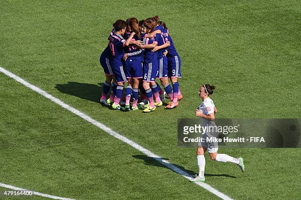Aya Miyama of Japan celebrates with team mates after scoring from the pwnalty spotduring the FIFA Women's World Cup 2015 Semi Final match between...