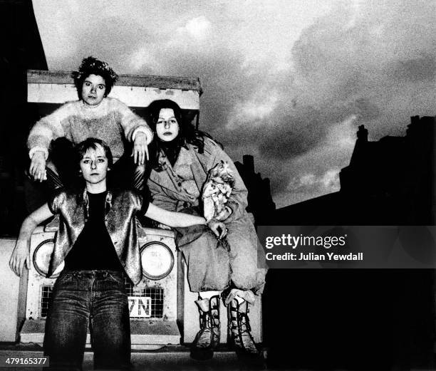 Members of British punk group The Slits, posing on a Land Rover in Daventry Street London, NW1, 1977. Clockwise, from top left: drummer Palmolive ,...