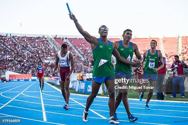 Anderson Freitas Henriques of Brazil crosses the finish line of Men's 4x400 relay during day ten of the X South American Games Santiago 2014 at...