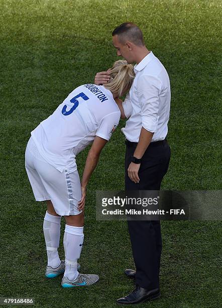 England coach Mark Sampson consoles captain Steph Houghton of England after their defeat in the FIFA Women's World Cup 2015 Semi Final match between...