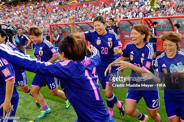 The Japan bench, including Yuri Kawamura of Japan, Kana Kitahara, Megumi Kamionobe and Yuika Sugasawa, storm the field following their 2-1 win over...