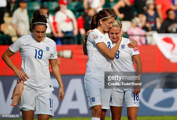 Jodie Taylor, Jill Scott and Toni Duggan of England walk dejected off the pitch after they were defeated by Japan during the FIFA Women's World Cup...