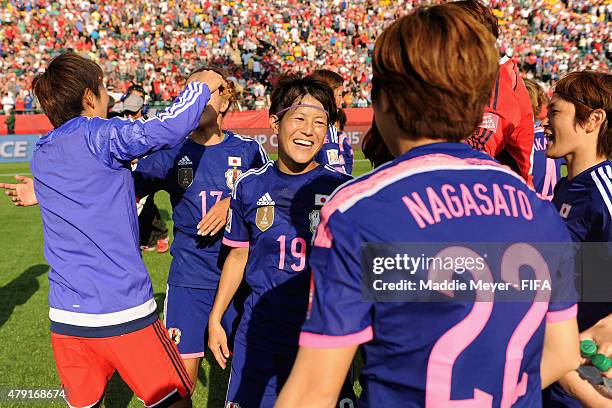 Saori Ariyoshi of Japan and Asano Nagasato celebrate their 2-1 win over England in the FIFA Women's World Cup Canada 2015 semi final match between...