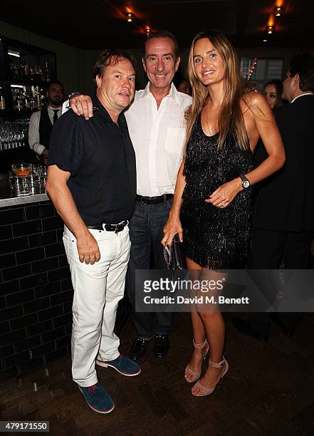 John Hitchcox, Robert Hanson and Masha Markova attend a dinner following the private view of "Raw Footage" at The Cafe Royal on July 1, 2015 in...