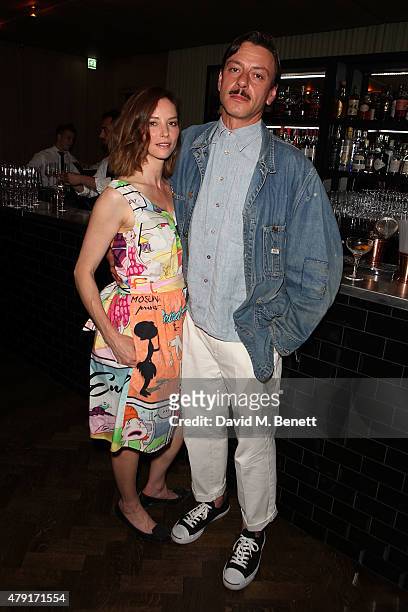 Sienna Guillroy and Enzo Cilenti attend a dinner following the private view of "Raw Footage" at The Cafe Royal on July 1, 2015 in London, England.