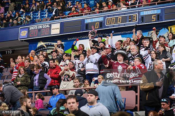 Fans of the Red Deer Rebels cheer on their team after they defeated the Edmonton Oil Kings during a WHL game at Rexall Place on March 16, 2014 in...