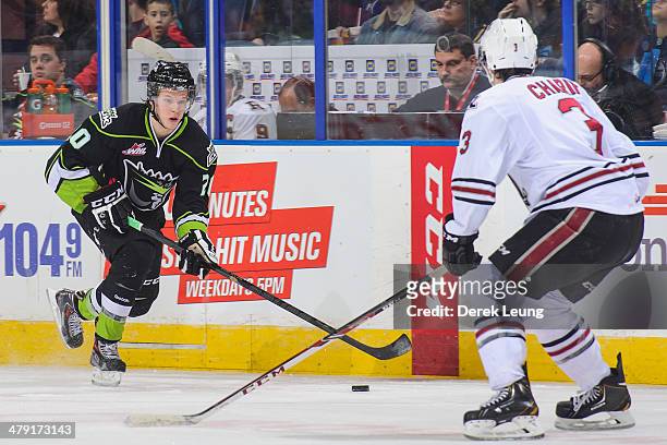 Mads Eller of the Edmonton Oil Kings skates against Nick Charif of the Red Deer Rebels during a WHL game at Rexall Place on March 16, 2014 in...