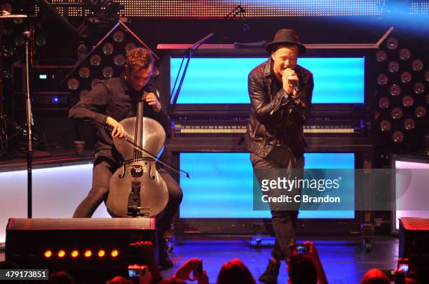 Brent Kutzle and Ryan Tedder of OneRepublic perform on stage at The Roundhouse on March 16, 2014 in London, United Kingdom.