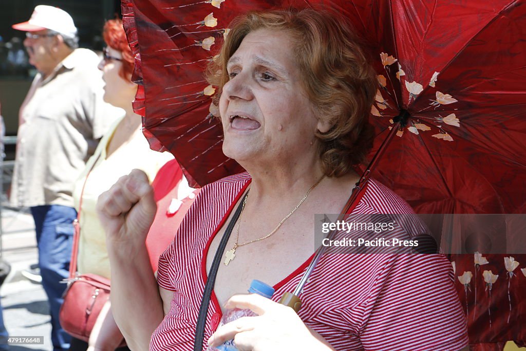 A Greek pensioner shouts slogans during the march from the...