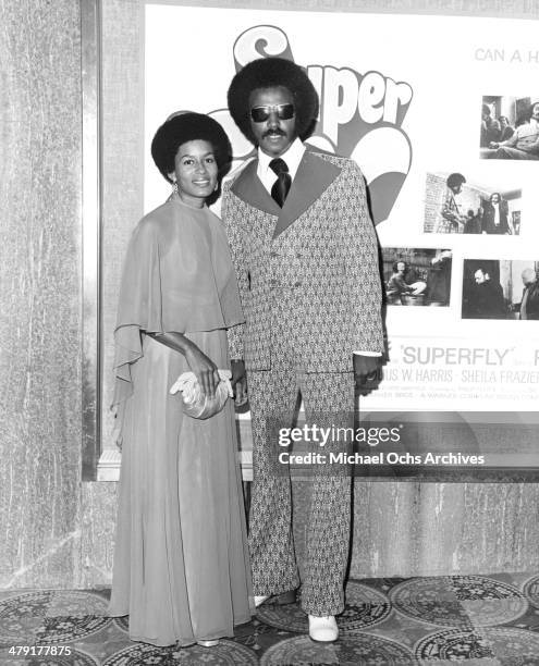 Costume designer Nate Adams and his wife pose at the premiere of the Warner Bros. Movie "Super Fly" circa 1972.