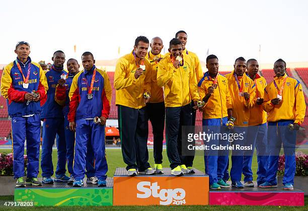 Team Venezuela, team Brazil and team Colombia in the podium of Men's 4x100 relay on day ten of the X South American Games Santiago 2014 at Estadio...