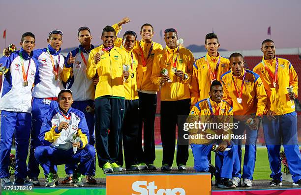 Team Panama, team Brazil and team Colombia in the podium of Men's 4x400 relay on day ten of the X South American Games Santiago 2014 at Estadio...