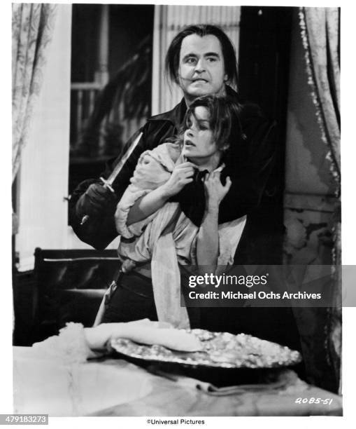 Actor Peter Boyle and actress Genevieve Bujold in a scene from the Universal Pictures movie "Swashbuckler" circa 1976.