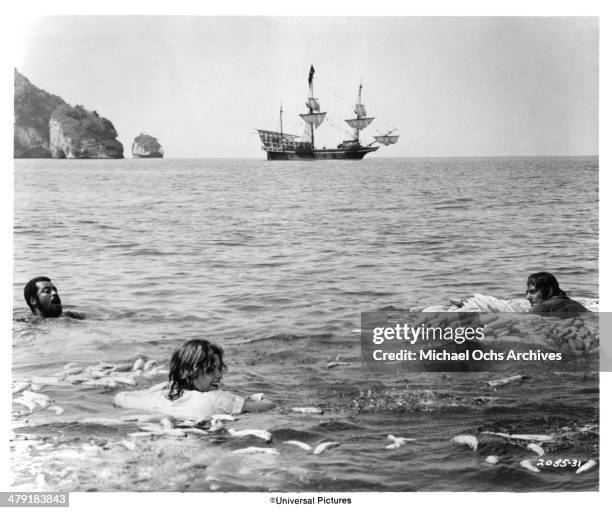 Actor James Earl Jones, actress Genevieve Bujold and actor Robert Shaw in a scene from the Universal Pictures movie "Swashbuckler" circa 1976.