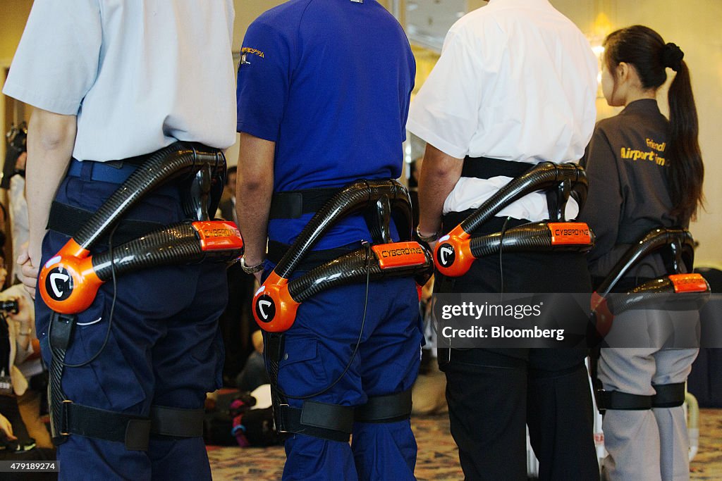 Cyberdyne Inc.'s Hybrid Assistive Limb (HAL) Exoskeleton Robot Suit, Transport Robot And Clean Robot Are Demonstrated At Haneda Airport