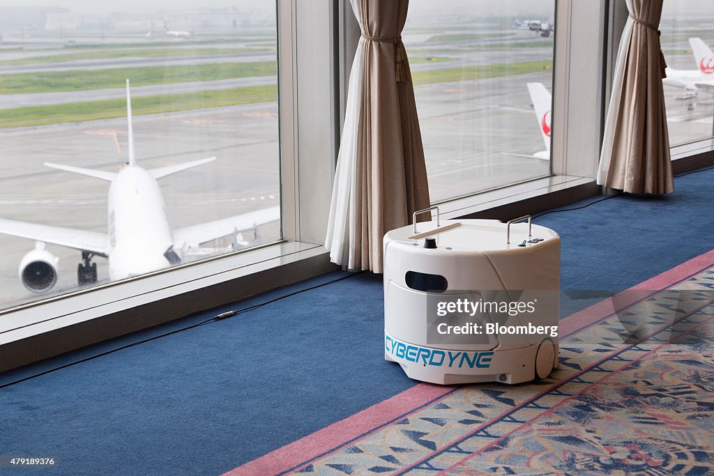 Cyberdyne Inc.'s Hybrid Assistive Limb (HAL) Exoskeleton Robot Suit, Transport Robot And Clean Robot Are Demonstrated At Haneda Airport