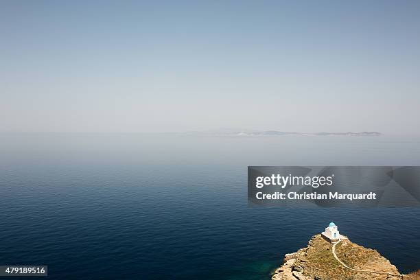 Old Greec orthodox church on top of a small hill next to Aegean Sea on June 17, 2015 in Sifnos, Greece. Sifnos is a island in the western Aegean Sea,...