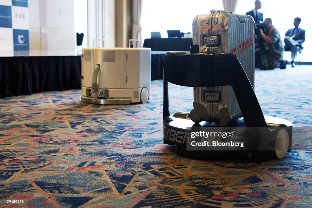 Cyberdyne Inc.'s Hybrid Assistive Limb (HAL) Exoskeleton Robot Suit, Transport Robot And Clean Robot Are Demonstrated At Haneda Airport
