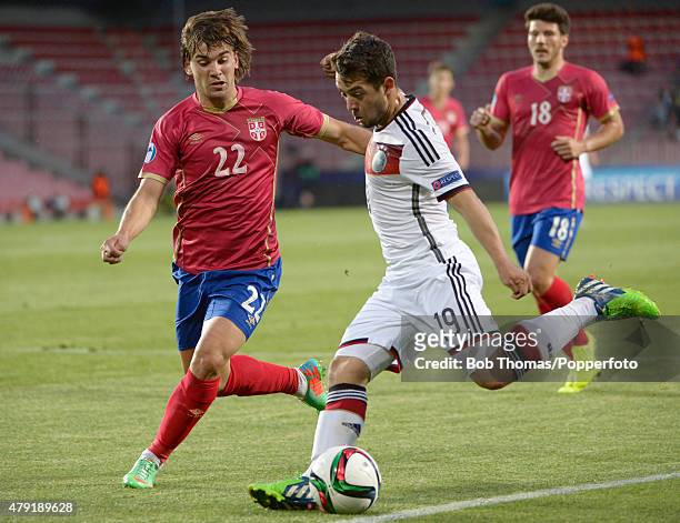 Filip Stojkovic of Serbia with Amin Younes of Germany during the UEFA European Under-21 Group A match between Germany and Serbia at Letna Stadium on...