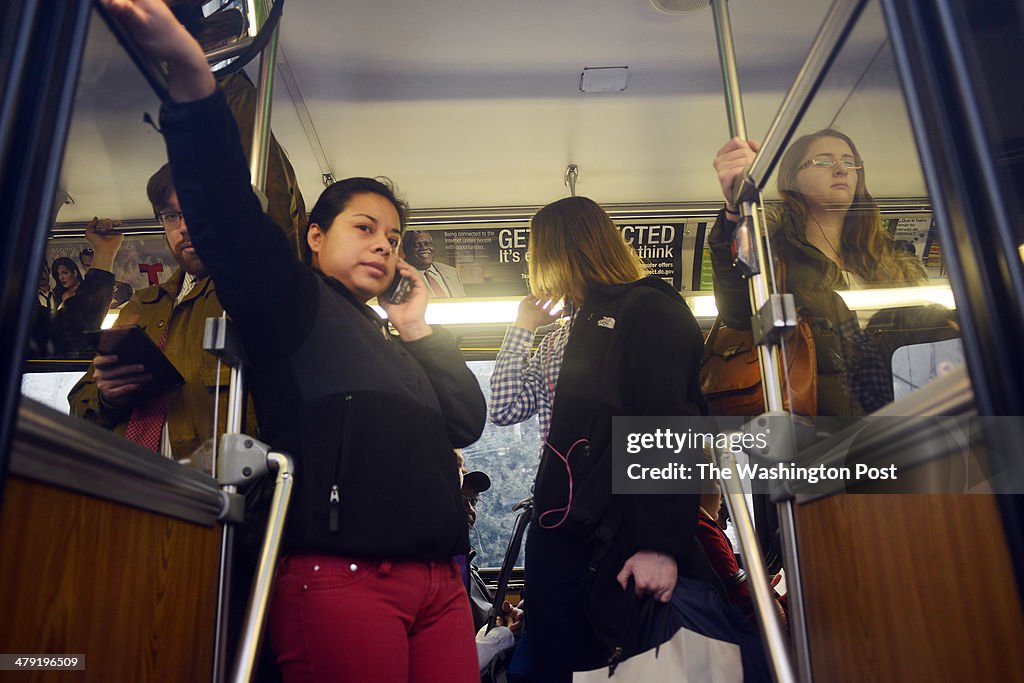 WASHINGTON, D.C., MARCH 12,  2014: Bus riders squeeze into a bu