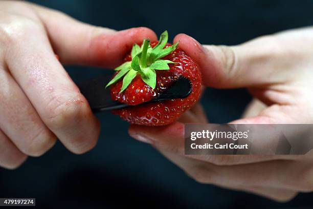 Strawberry is prepared on day four of the Wimbledon Lawn Tennis Championships at the All England Lawn Tennis and Croquet Club on July 2, 2015 in...