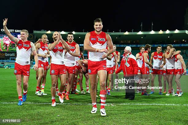 Toby Nankervis of the Swans and team mates celebrate winnning the round 14 AFL match between the Sydney Swans and the Port Adelaide Power at SCG on...