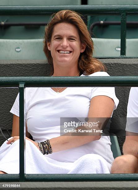 Amelie Mauresmo attends the Robin Hasse v Andy Murray match on day four of the Wimbledon Tennis Championships at Wimbledon on July 2, 2015 in London,...