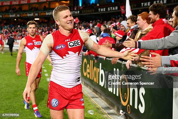 Dan Hannebery of the Swans celebrates with fans after winning the round 14 AFL match between the Sydney Swans and the Port Adelaide Power at SCG on...
