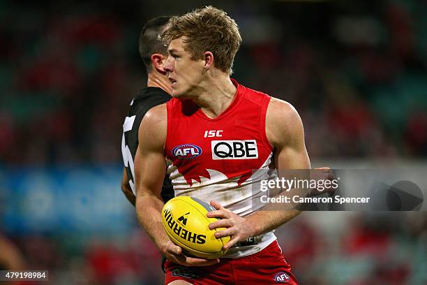 Luke Parker of the Swans controls the ball during the round 14 AFL match between the Sydney Swans and the Port Adelaide Power at SCG on July 2, 2015...