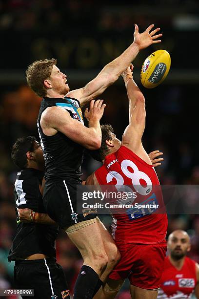 Matthew Lobbe of the Power and Mike Pyke of the Swans contest the ball during the round 14 AFL match between the Sydney Swans and the Port Adelaide...