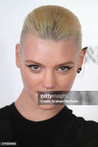 Model Montana Cox poses as she arrives for the 2014 Virgin Australia Melbourne Fashion Festival Opening Event presented by David Jones at Docklands...