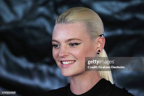 Model Montana Cox poses as she arrives for the 2014 Virgin Australia Melbourne Fashion Festival Opening Event presented by David Jones at Docklands...