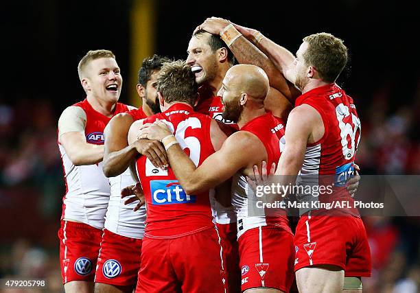 Toby Nankervis of the Swans celebrates with team mates after kicking a goal during the round 14 AFL match between the Sydney Swans and the Port...