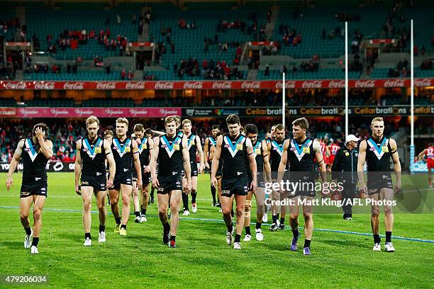 Port Adelaide players walk from the field after the round 14 AFL match between the Sydney Swans and the Port Adelaide Power at SCG on July 2, 2015 in...